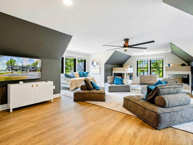 Bunk Room Loft - The expansive upper-level retreat includes a TV lounge, built-in bunks, a daybed, and seating for the whole group.