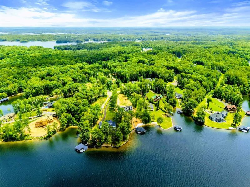 Aerial View - A sweeping panoramic of the Private Side of Lake Anna, with green forests and calm blue water.