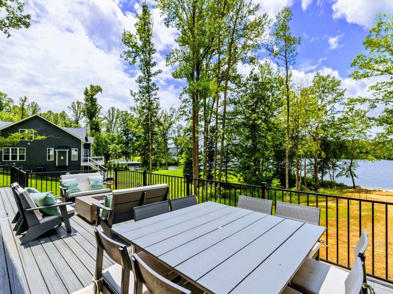 Upper Deck - Take in the treetop views and lake breezes from this elevated outdoor living space.