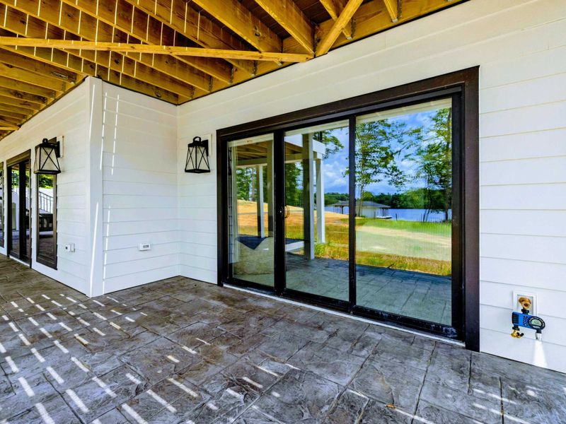 Deck - Refined walkout access keeps the lake close, even when you're cooling off under the covered patio.