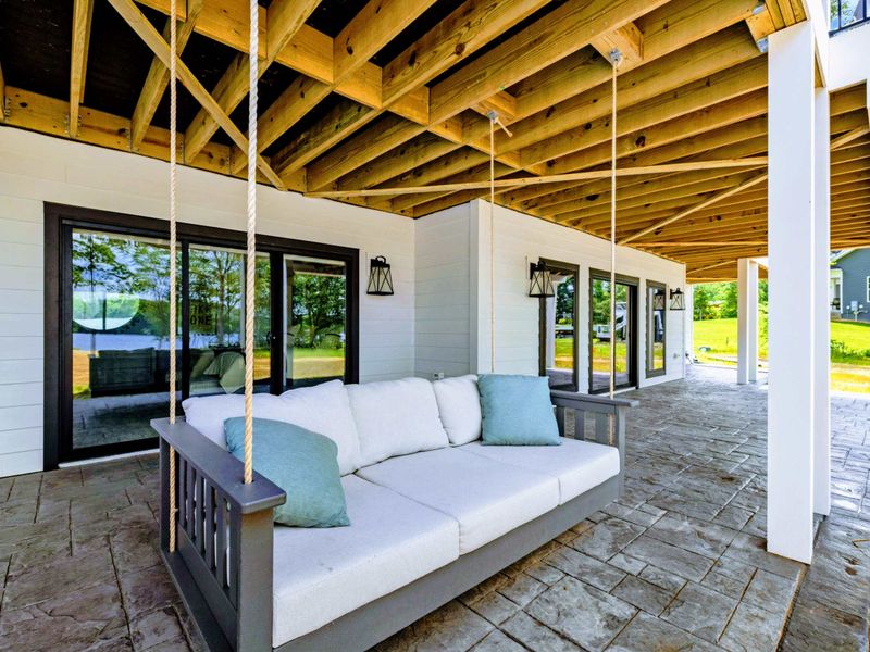 Deck - Slip away with a book, a breeze, and the calm of the covered deck surrounding you.