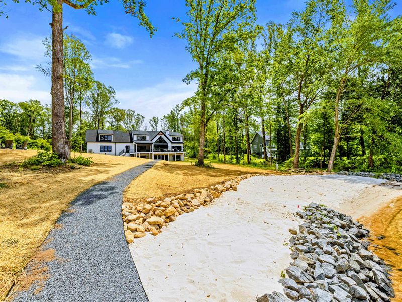 Backyard - The only commute you'll love: a short walk from the house to the lake in under a minute.