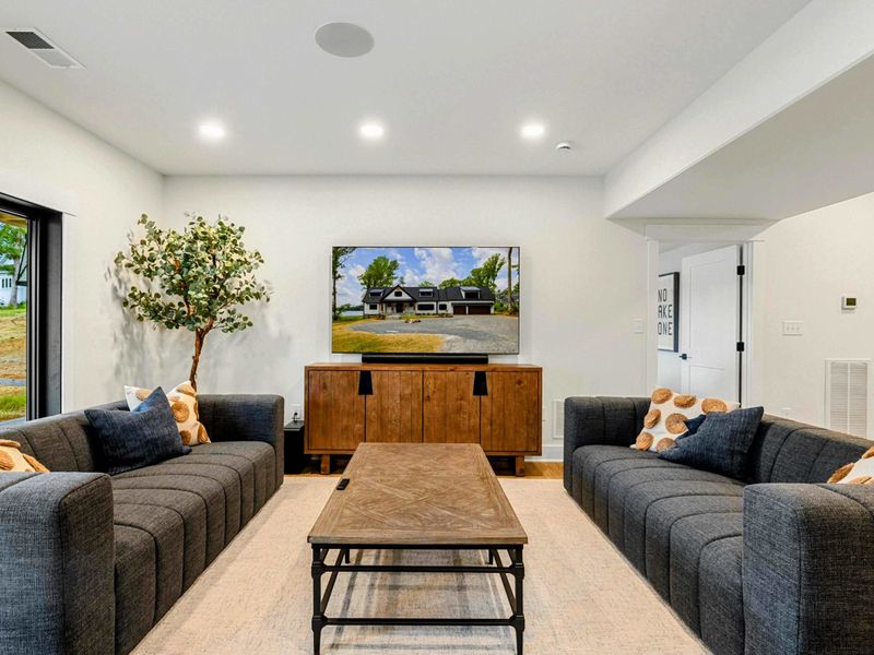 Game Room Lounge - Comfortable modular seating and a media console make this a laid-back space for movies and game days.