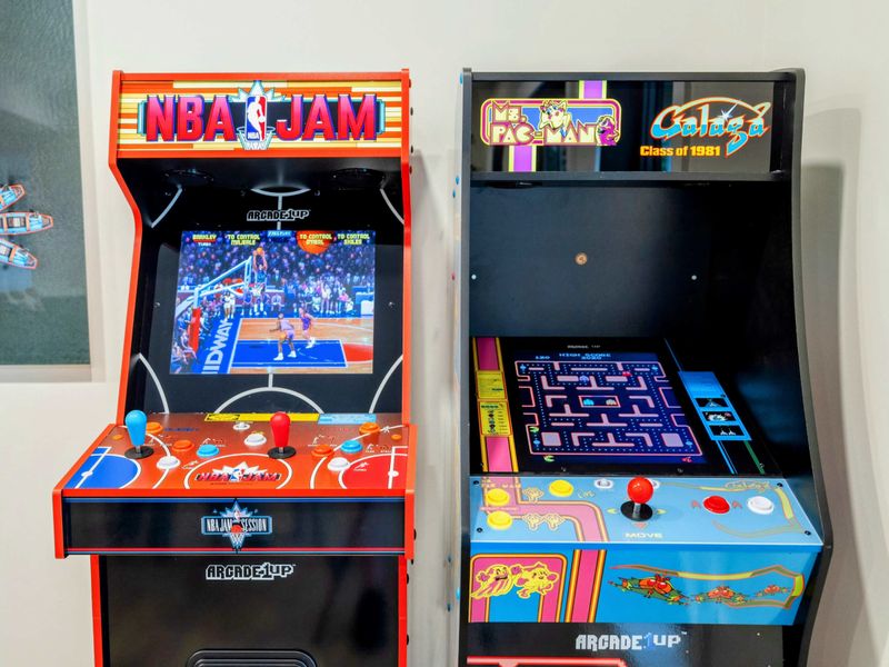 Game Room - Classic arcade cabinets featuring NBA Jam and Ms. Pac-Man bring retro fun to the lake level.