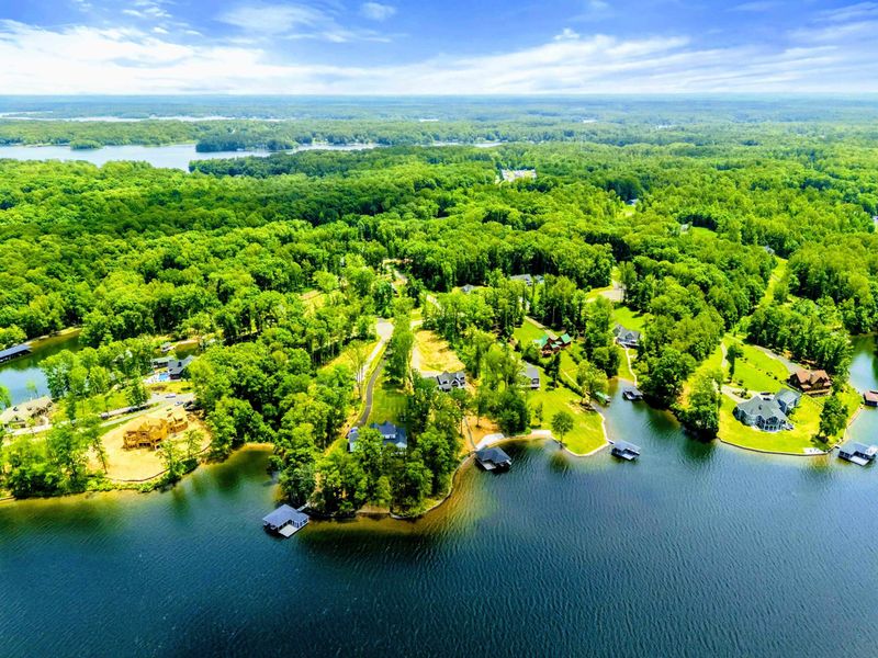 Aerial View - A sweeping drone perspective captures the winding coves and lush shoreline of Lake Anna's Private Side.