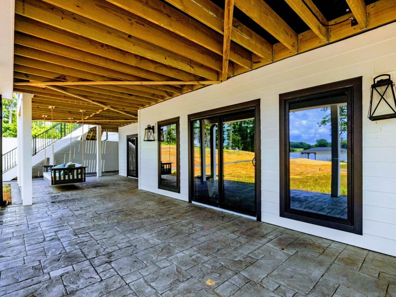 Deck - Refined indoor-outdoor design keeps everyone connected to the lake without feeling crowded.