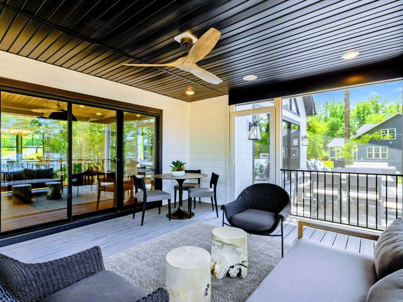 Entryway - A grand front door with glass panels welcomes guests into the open-concept main level.