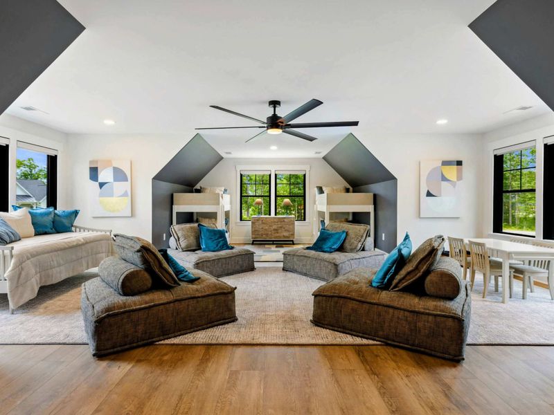 Bunk Room Loft - A massive open loft with built-in bunk alcoves, modular loungers, a daybed, and a kids' table creates the ultimate hangout.