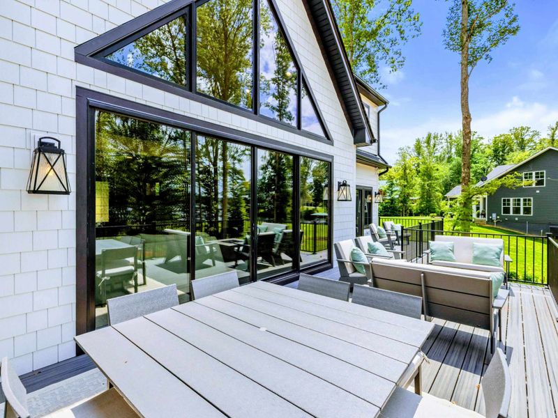 Rear Exterior - The multi-level design blends modern farmhouse style with relaxed lakefront living.