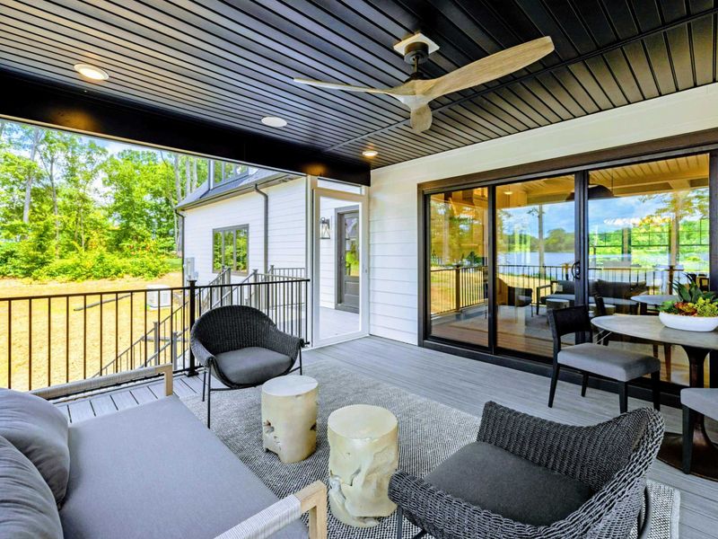 Rear Exterior - Generous decks and covered spaces create a seamless flow from indoors to the shoreline.
