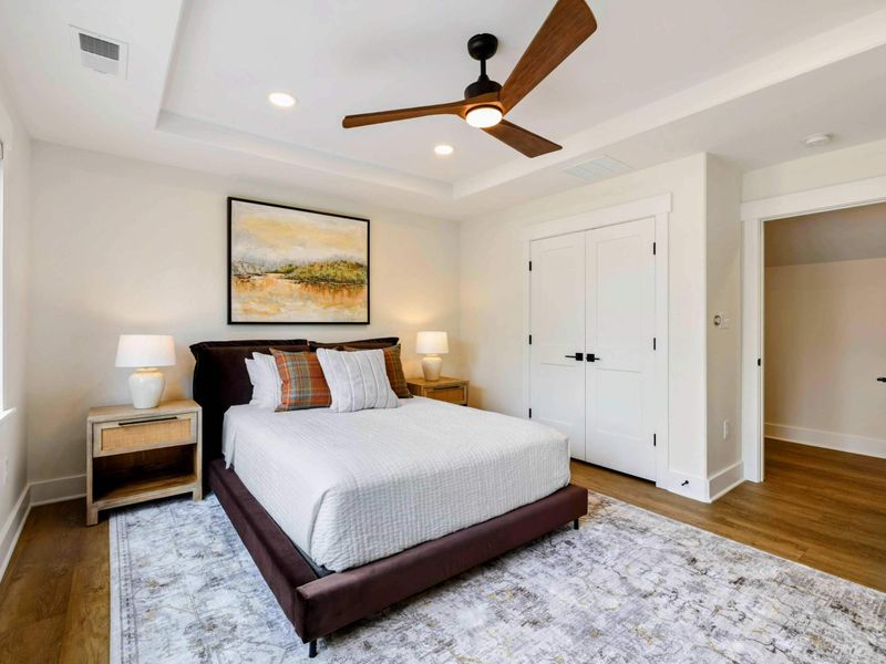 Bedroom 6 - The king bed faces a landscape painting with the en-suite bathroom and closet just steps away.