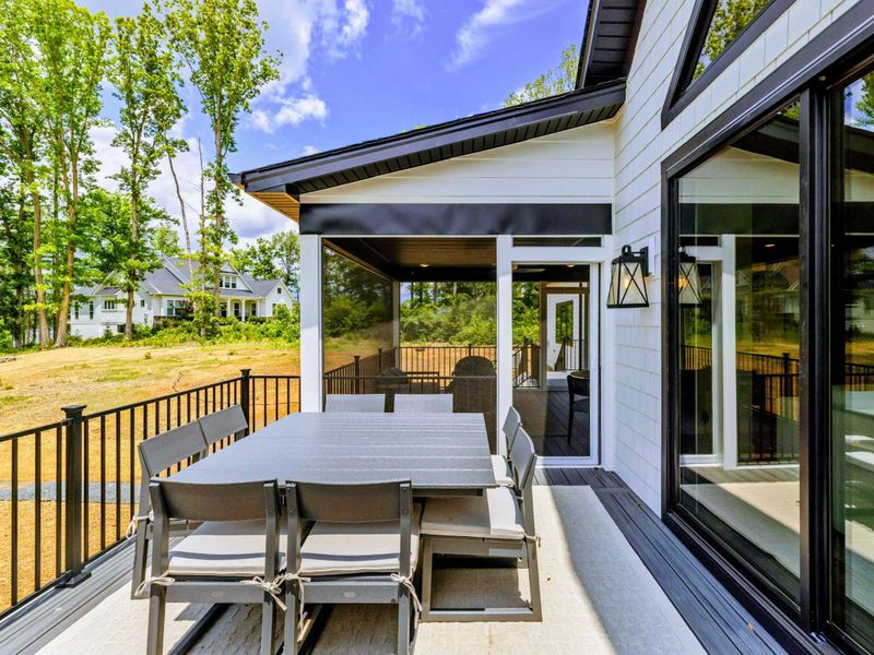 Deck - Multiple levels of outdoor seating connect the home to the lakefront grounds.