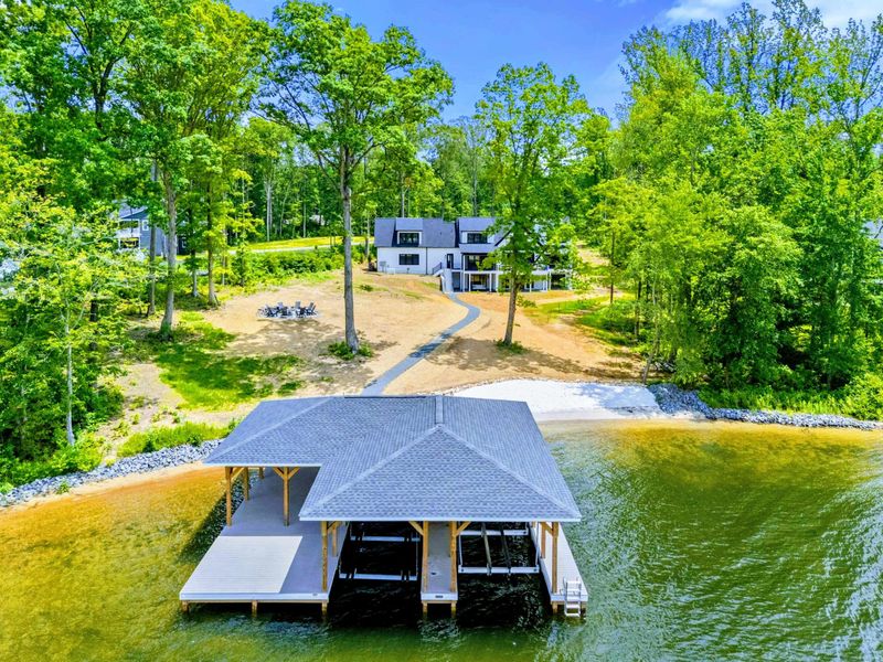 Backyard - Open water, green canopy, and your own shoreline create a scene that feels simple, beautiful, and unhurried.