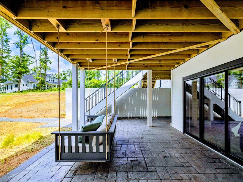 Deck - Dry off, swing awhile, step inside, repeat. The covered deck sets an easy lakehouse rhythm.