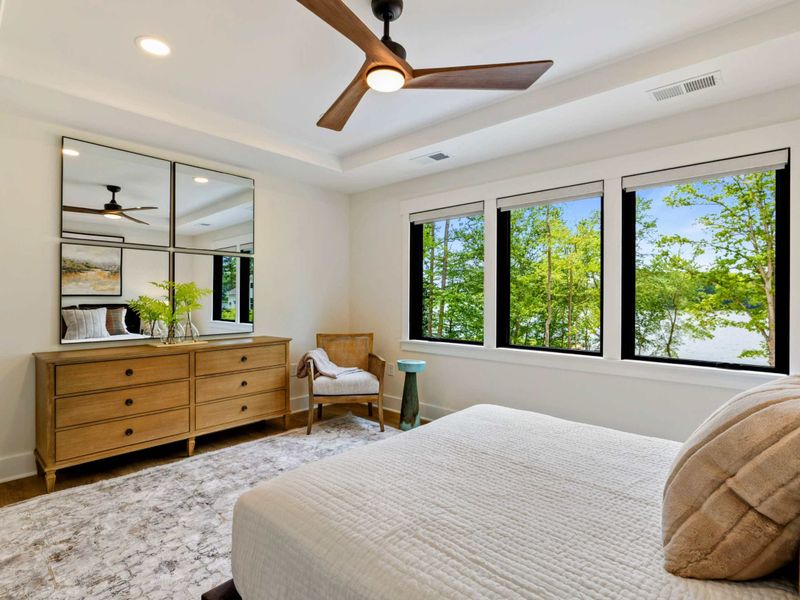 Bedroom 6 - Four windows wrap the corner of this upper-level king suite, filling the room with natural light and treetop views.