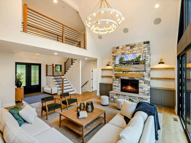 Upper Landing - A stylish railing frames the open-air loft above the soaring main living area.
