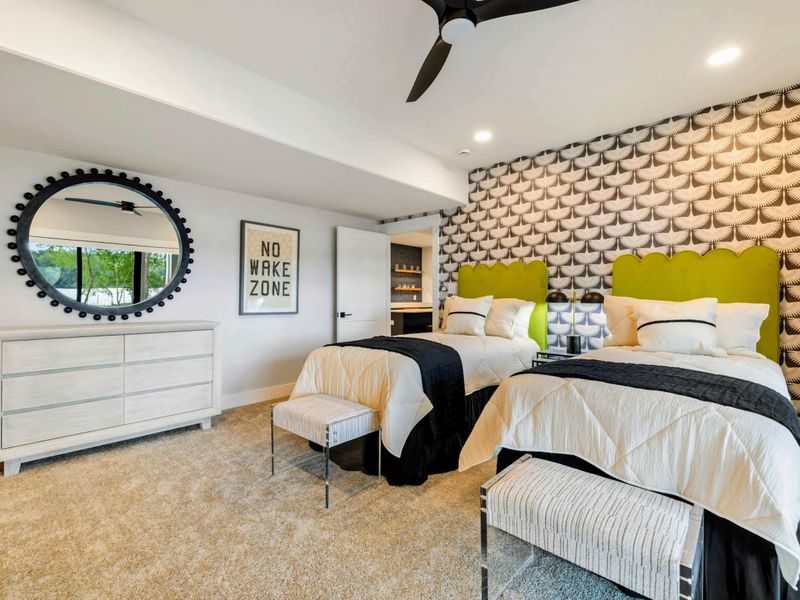 Bedroom 3 - A round mirror, dresser, and "No Wake Zone" sign complete the fun, lake-inspired design of this spacious guest room.