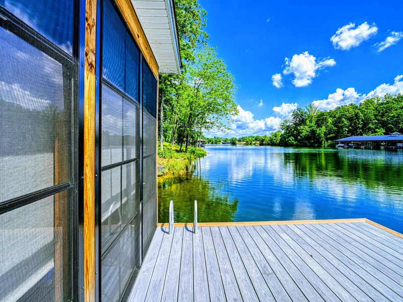 Dock Platform - The dock's open platform offers a serene waterside retreat with clear views across the calm lake.