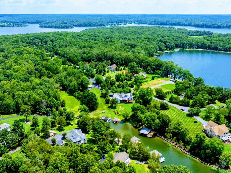 Aerial - Broad view of the Lake Anna shoreline with waterfront properties nestled among the trees.