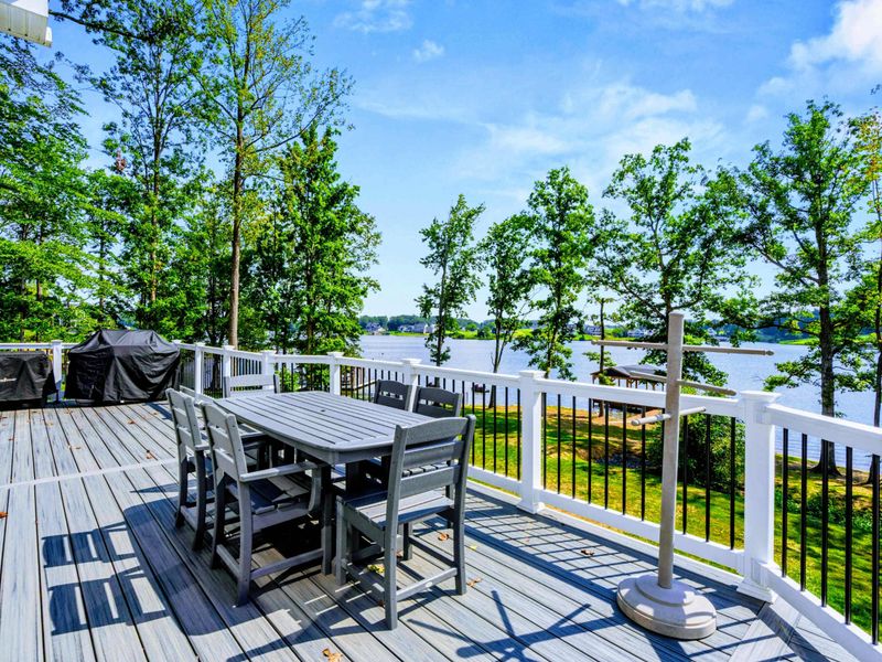 Deck Dining - Outdoor table for eight on the upper deck, the lake glittering through the trees and the grill steps away.