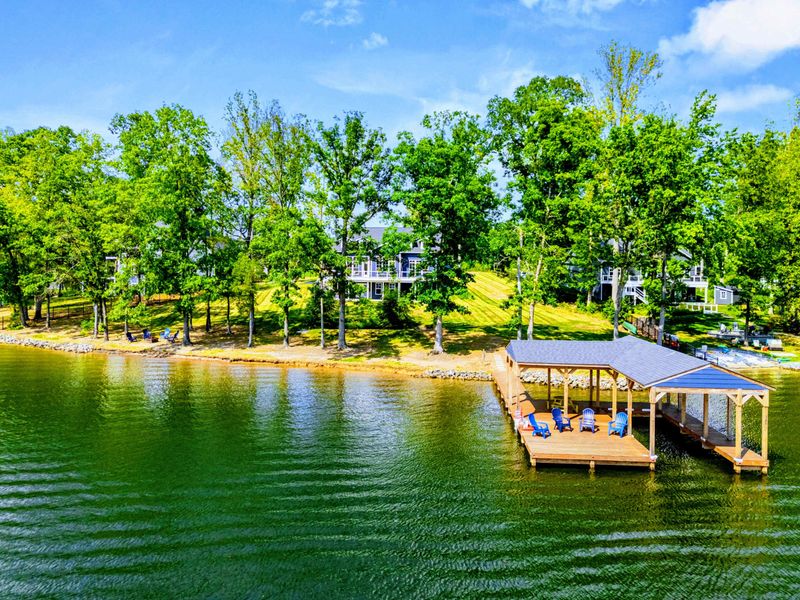 Aerial Waterfront - The Shoreline's prime lakefront lot, private dock, and quiet wooded shoreline seen from above.