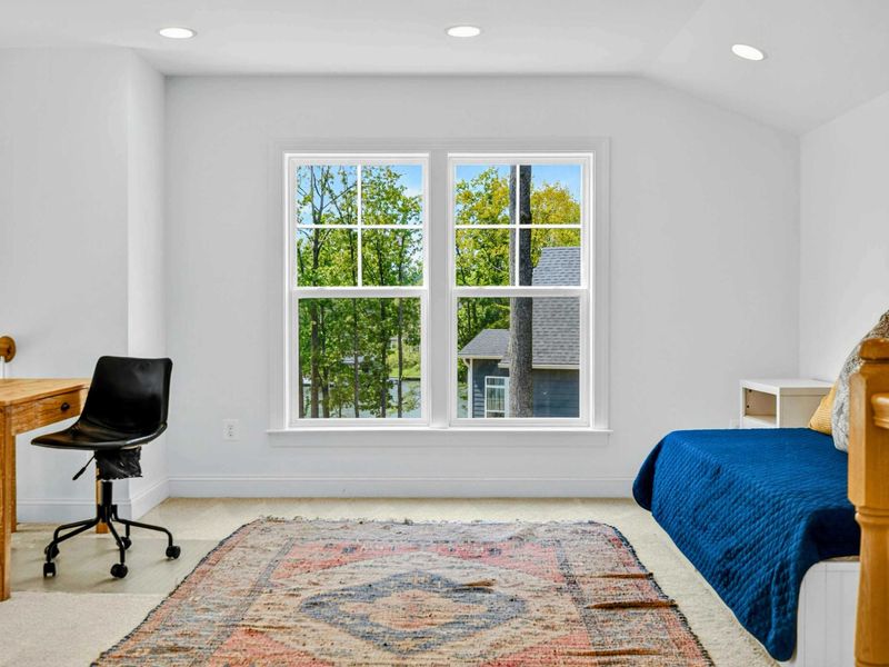 Loft Sleeping Nook - A twin bed and desk in the open loft offer flexible space for work, reading, or extra guests.