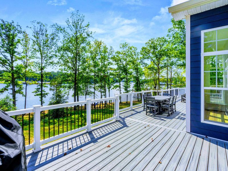 Deck Overlook - Step out from the great room to a sweeping deck made for sunset cocktails and lazy afternoon coffee.
