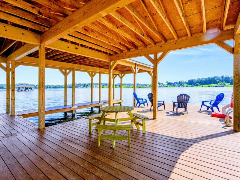 Covered Gazebo - Picnic table, Adirondack chairs, and timber framing keep you shaded while the lake glows just beyond the railing.