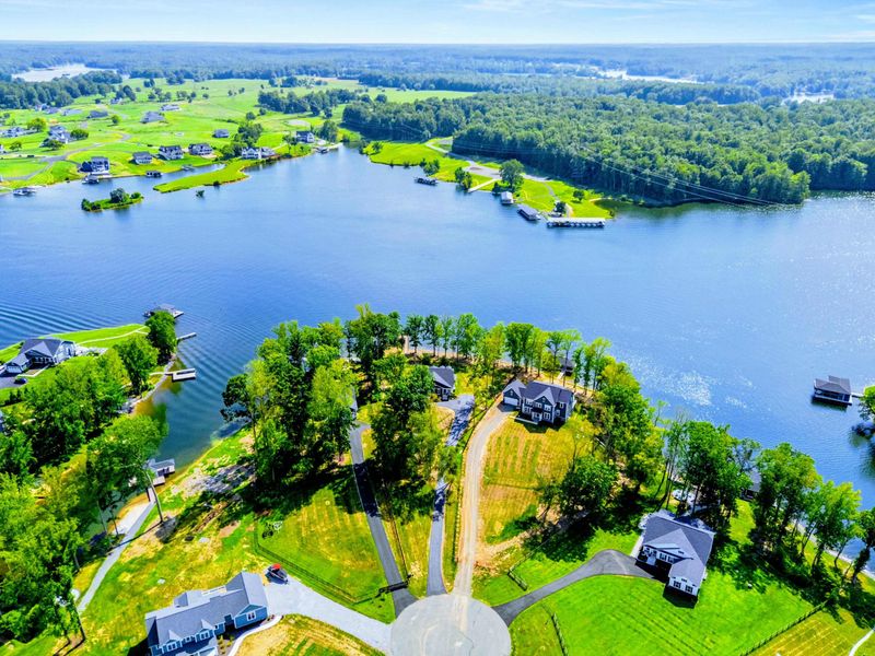 Aerial Lake View - The home's prime spot on a private peninsula, with the covered dock reaching out into the lake.
