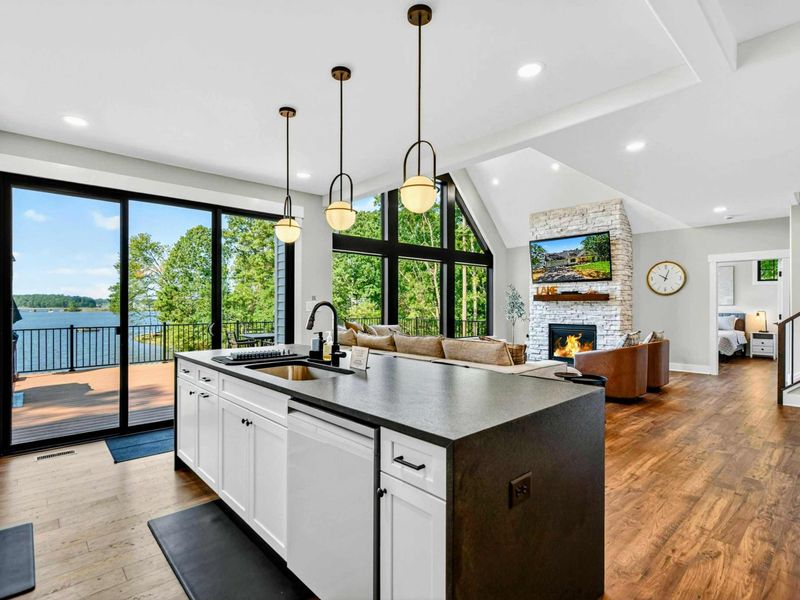 Great Room - Loft perspective captures the peak windows, deck, and Lake Anna stretching into the distance.