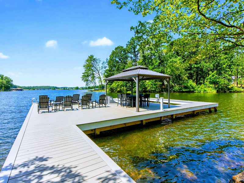 Private Dock - Composite walkway leads from shore to the expansive dock with gazebo and lounge chairs.