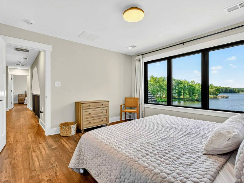 Bedroom 4 - Lake views and tree canopy fill the oversized window in this upper level suite.