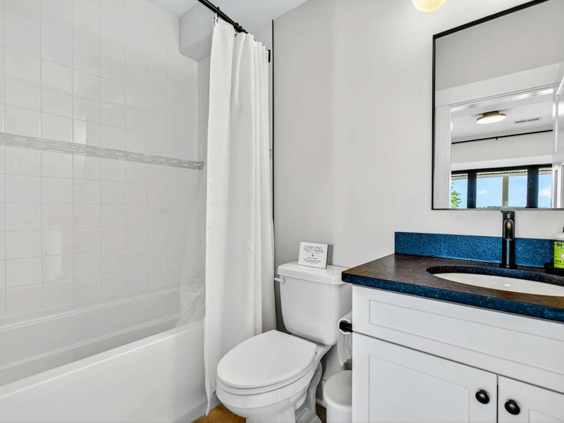 Bunk Bathroom - Tub and shower combo with single vanity, convenient for the bunk room crew.