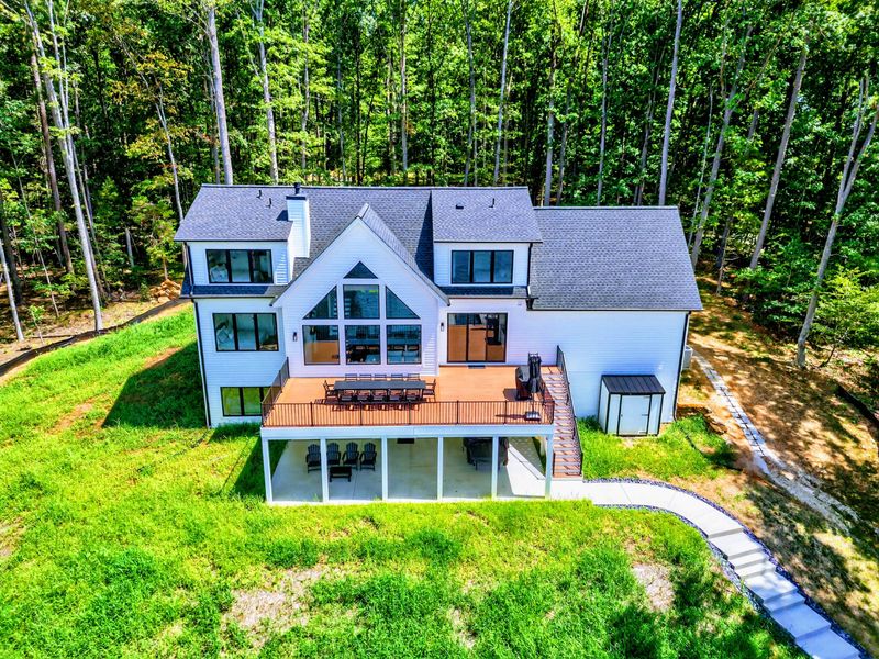 Aerial View - The expansive composite deck and lush yard from above.