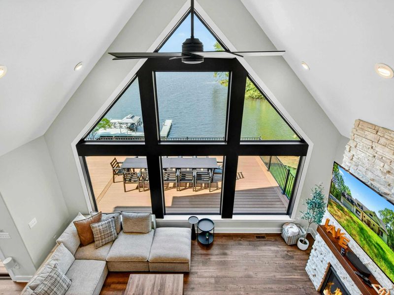 Great Room - View from the loft looks down on the living space and dramatic A-frame windows.