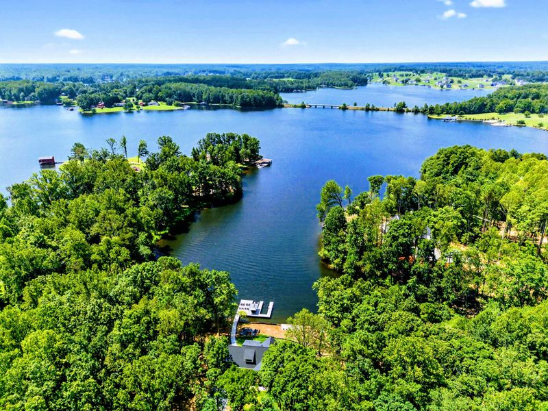 Aerial View - High altitude panorama of the cove, islands, and Lake Anna's blue expanse.