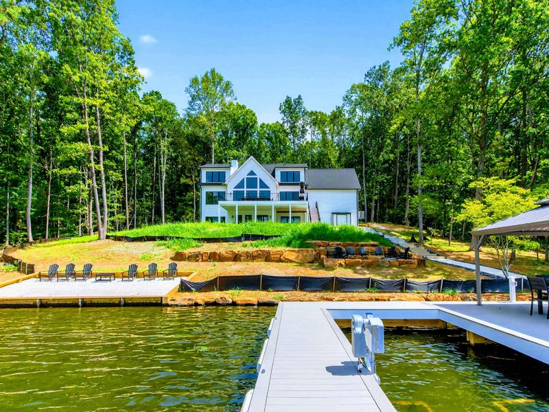 Waterfront - View from the lake captures the home on the hillside with the private dock below.