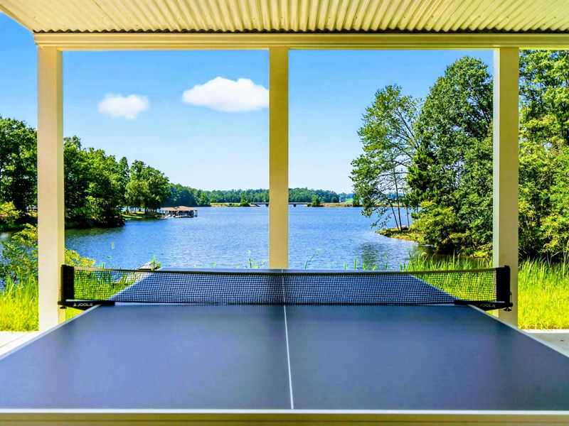 Covered Patio - Ping pong table and lake views from the covered lower level patio.