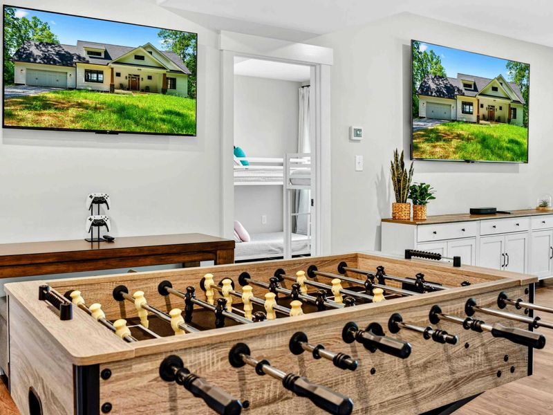 Game Room - Foosball table, dual Smart TVs, and a kitchenette keep everyone entertained on the lower level.