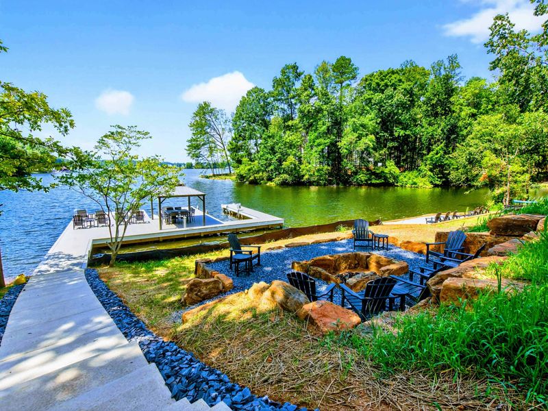 Fire Pit - Lakeside fire pit near the waterfront with the dock visible just steps away.