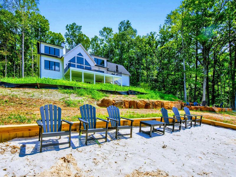 Sandy Beach - Wide view of the private beach area looking up at the custom-built retreat.