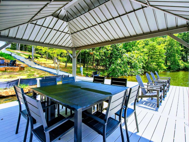 Dock Gazebo - Shaded dining and lounge seating on the dock with the walkway leading back to the house.