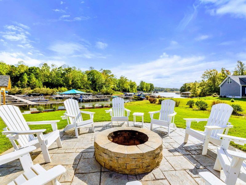 Fire Pit -The best view on the lake! Perched above the beach, our fire pit offers front row views of the water and is the perfect place to gather. Enjoy your morning coffee at sunrise or end the day sharing stories, laughter, and a glass of wine.