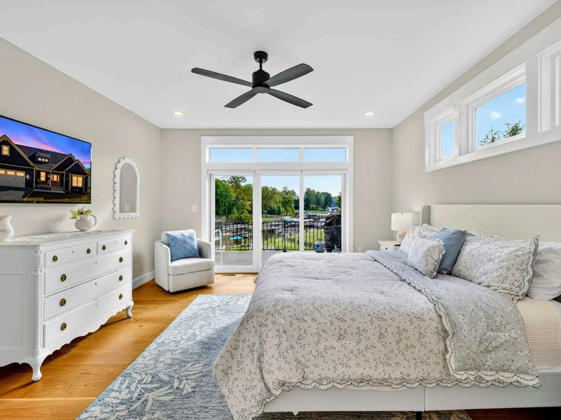 The primary king suite is the ultimate lakeside escape, blending luxury and charm with a plush king linen bed, a Smart TV, and beautiful antique accents. Wake to serene lake views and enjoy private deck access for sunrise cocktails.