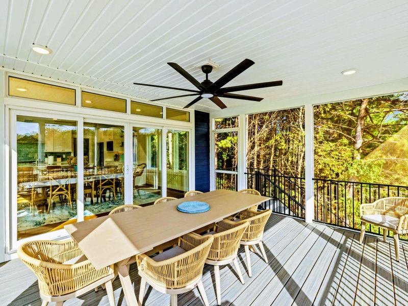 Screened Porch View - Our screen porch has an extra large table with seating up to eight with amazing lake views. It opens to our large party deck with plenty of lounge seating.