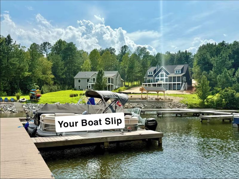 Boat Slip - It couldn't be any more convenient! Your dedicated boat slip at the dock, with the home and grounds visible from the water. The marina is steps away for you to launch your boat and also adjacent to pool/tennis/pickleball courts.