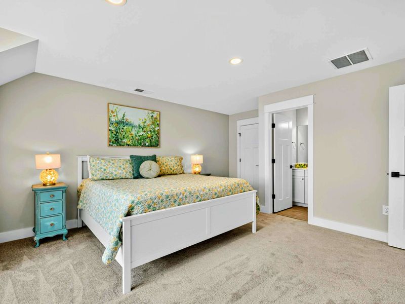 This king suite is full of charm, featuring high-end bedding, antique turquoise nightstands, dresser & private en-suite bath. From the whimsical 3-way antique lamps to the thoughtfully curated details, guests will love discovering the character!