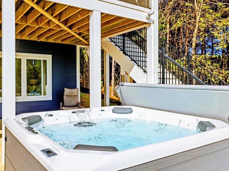 Hot Tub Close-Up - 8 Person Hot Tub! Warm, bubbling water awaits under the covered patio, just steps from the lake.
