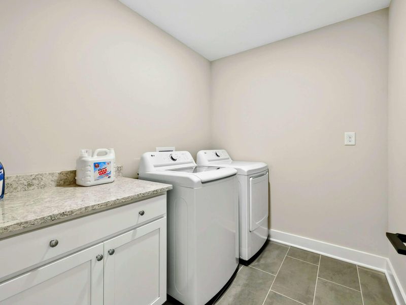 Laundry Room - A full-size washer and dryer with a folding counter keep laundry simple, even on vacation.