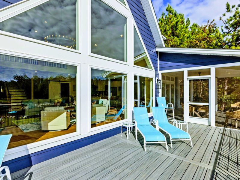 Deck and Windows -Our extra-large party deck is the perfect place to gather, unwind, and take in the spectacular lake views. The panorama is always changing, from boats cruising by to stunning sunsets, making it a favorite spot to enjoy lake life!